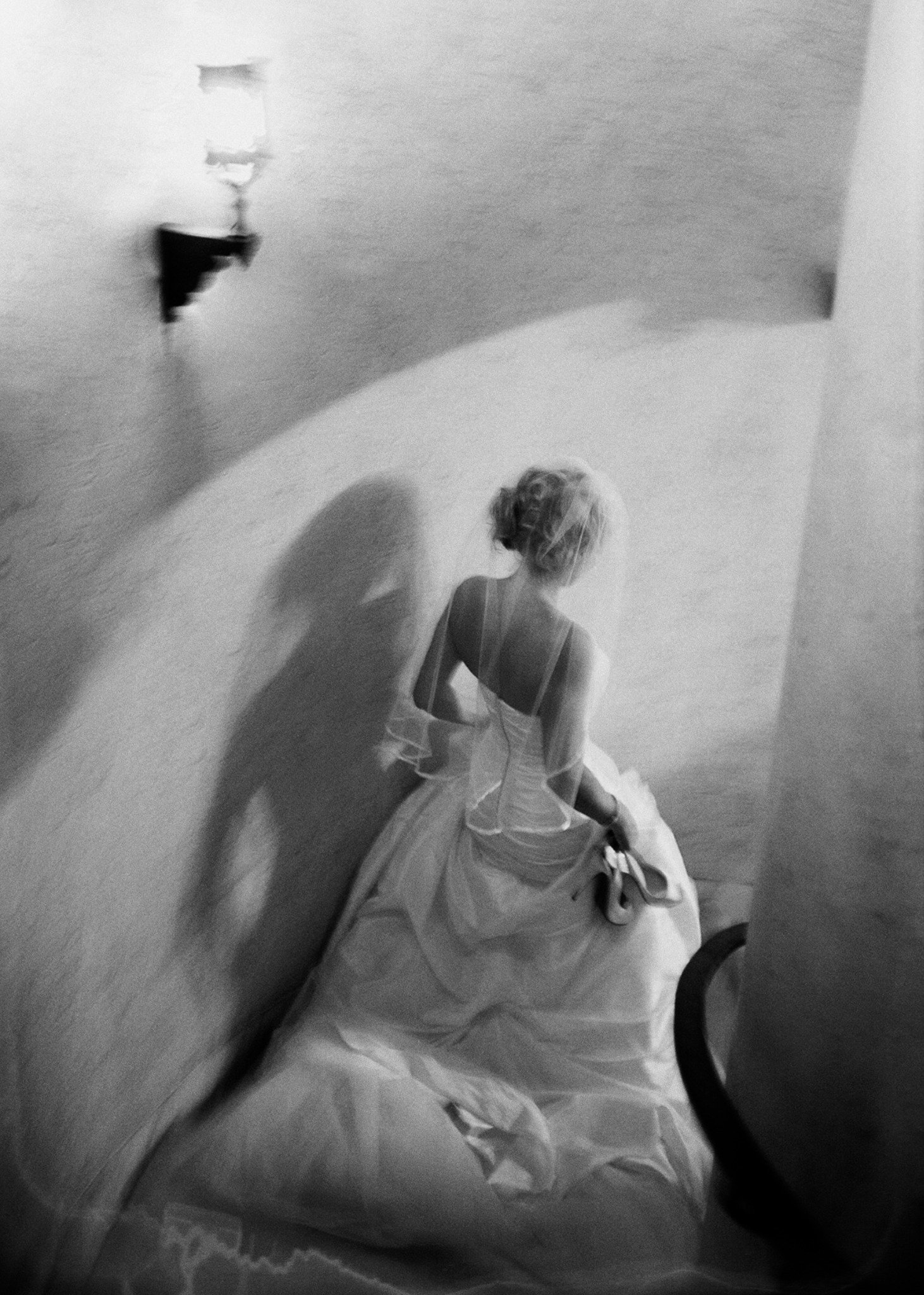 Bride on spiral stairway